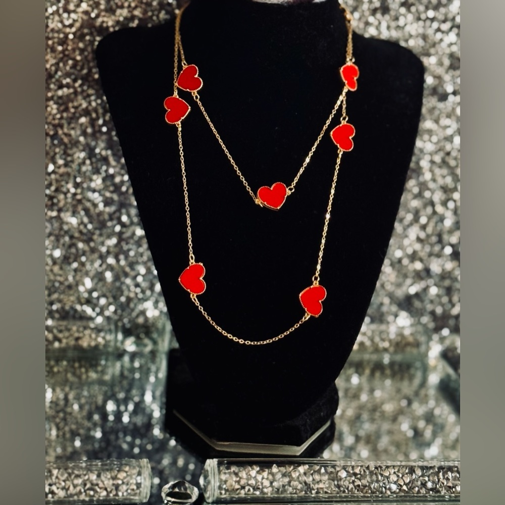 18 k gold plated designer inspired necklace with red enamel heart on both sides.